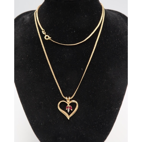 102 - An s link chain stamped 750. Suspending an open heart pendant with ruby and diamond detail. Stamped ... 