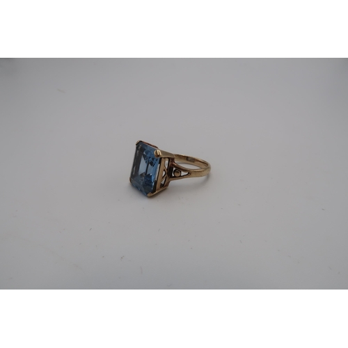 115 - A synthetic spinel single stone ring. Size M 1/2. Stamped 9ct. Weight 5.08 grams