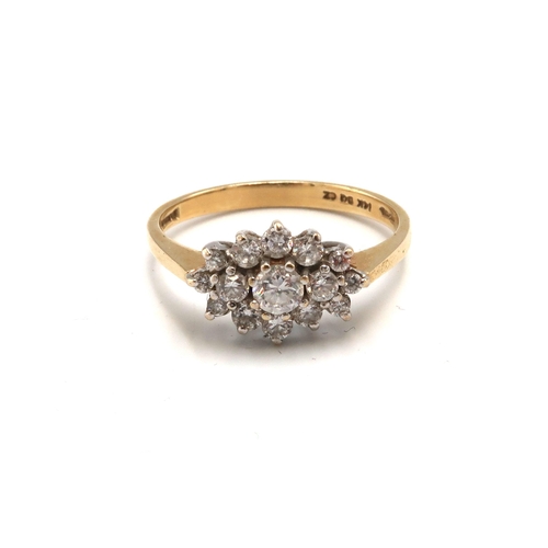 117 - A 14ct gold and cubic zirconia dress ring of flowerhead and leaf form, size P, 2.3g.