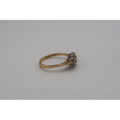 117 - A 14ct gold and cubic zirconia dress ring of flowerhead and leaf form, size P, 2.3g.