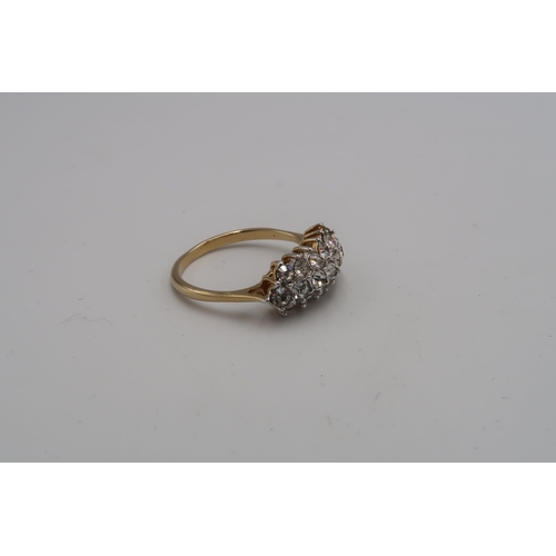 121 - A 14ct gold and cubic zircoonia triple row dress ring, size P, unmarked but testing as 14ct, 3.1g.