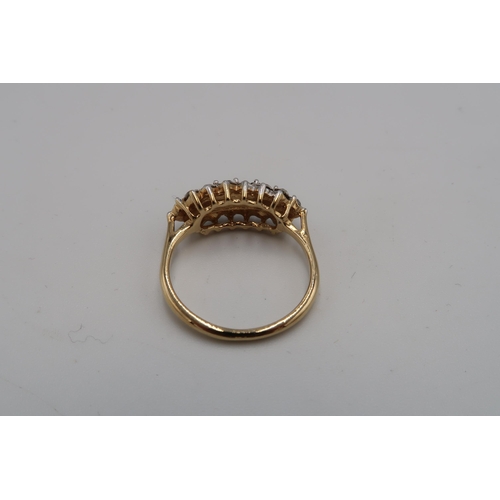 121 - A 14ct gold and cubic zircoonia triple row dress ring, size P, unmarked but testing as 14ct, 3.1g.