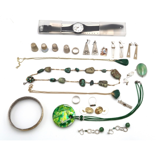 129 - A group of costume jewellery including 9ct gold and silver ring, an enamel Mary and Joseph pendant, ... 