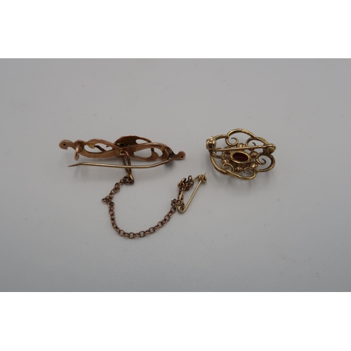 138 - Two hallmarked 9ct yellow gold brooches - The first of scroll design, hallmarked Chester 1911 - the ... 