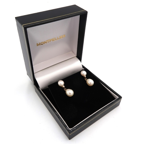 144 - A pair of 14ct gold, diamond and pearl drop earrings, each set with teardrop shaped pearl suspended ... 