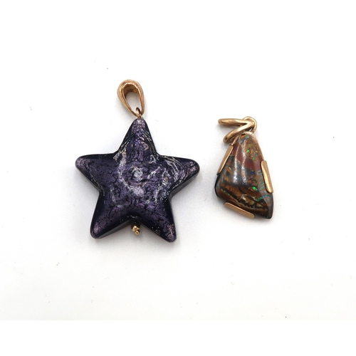 157 - A 9ct gold set pendant with opal striated stone, 3.0g, and a purple glass star pendant, possibly Mur... 