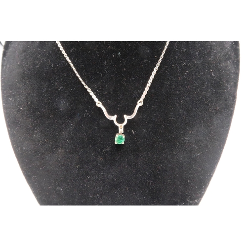 160 - A 9ct white gold diamond and emerald set necklace, with guilloche links to a scroll setting with sin... 