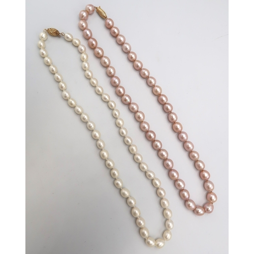 161 - A string of oval shaped pearls and another of pale pink pearls, each with 14ct gold clasp, both 46.5... 