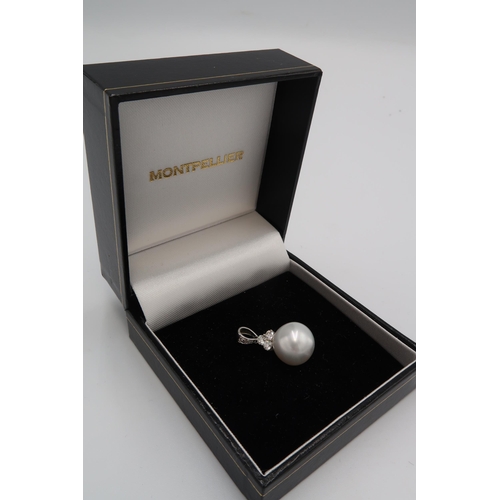 163 - An 18ct white gold, diamond and large pearl pendant, the pale grey white pearl of approximately 12.3... 