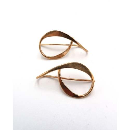 174 - A pair of 14ct gold earrings of looped design, 3.1g total weight.