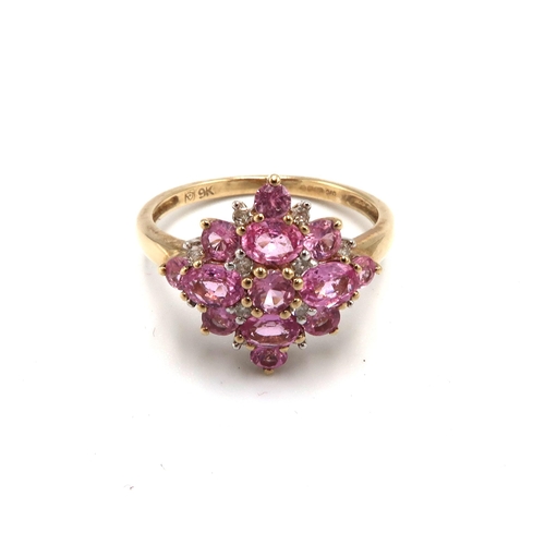 194 - A 9ct gold pink sapphire and diamond cluster ring. Size P 1/2. Weight 2.57 grams.