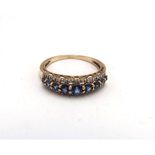 195 - A 9ct gold sapphire and diamond graduated half eternity ring. Size Q 1/2. Weight 2.13 grams