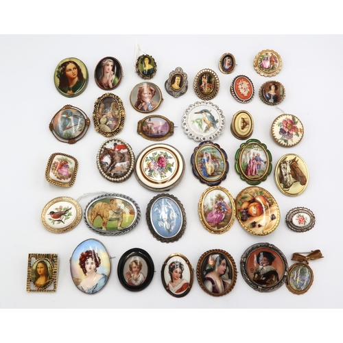 222 - An assortment of 35 porcelain and other brooches.