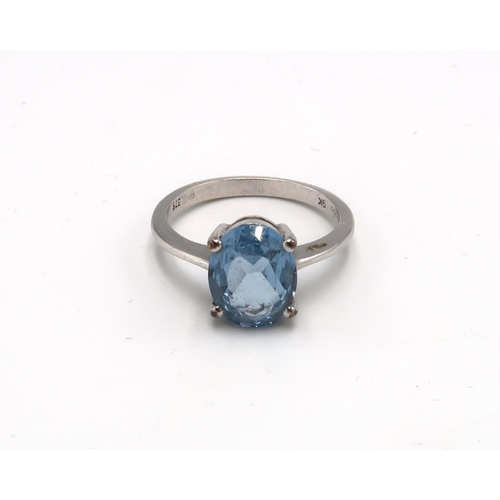 225 - A synthetic spinel single stone ring. Stamped 9K. Size O 1/2. Weight 3.21grams