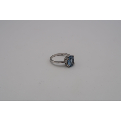 225 - A synthetic spinel single stone ring. Stamped 9K. Size O 1/2. Weight 3.21grams