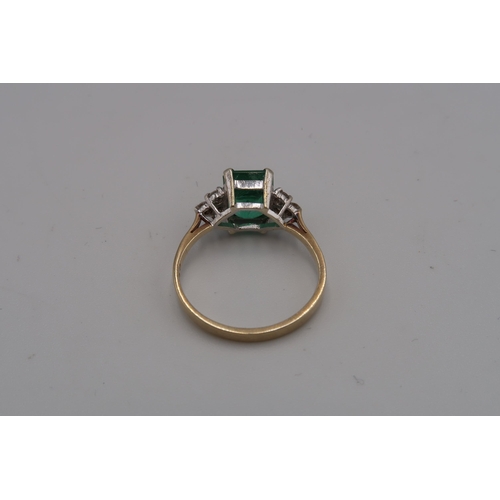 226 - A 9ct gold emerald and diamond dress ring. Emerald measuring approximately 7mm by 7.7mm. Ring size O... 