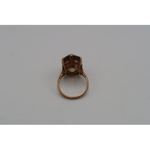 227 - A 9ct gold smokey quartz single stone ring. Size N 1/2. Weight 5.62 grams