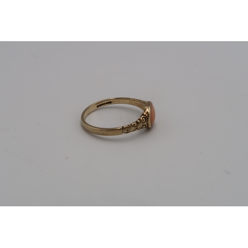 228 - A 9ct gold coral ring. Size P. Weight 1.61 grams