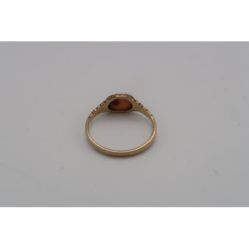 228 - A 9ct gold coral ring. Size P. Weight 1.61 grams