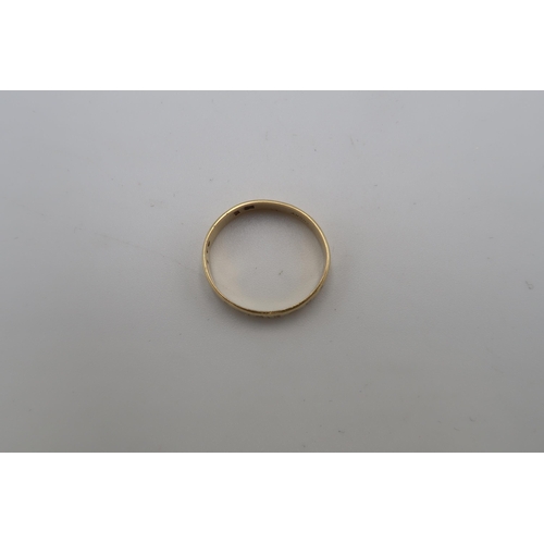 229 - An 18ct gold textured band ring. Size N. Weight 3.04 grams