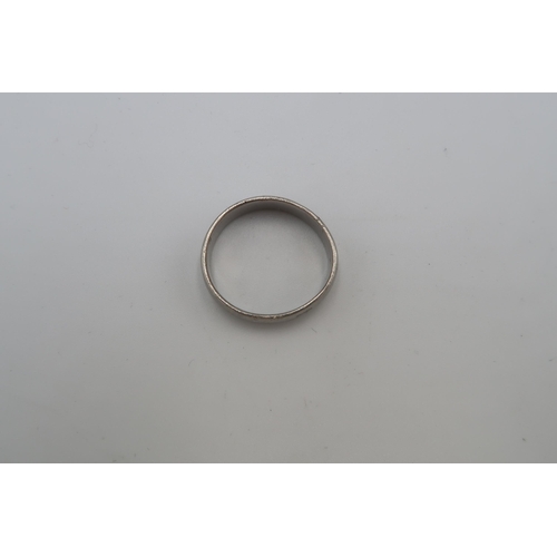 231 - A platinum 6mm band ring. Size U. Weight 6.12 grams