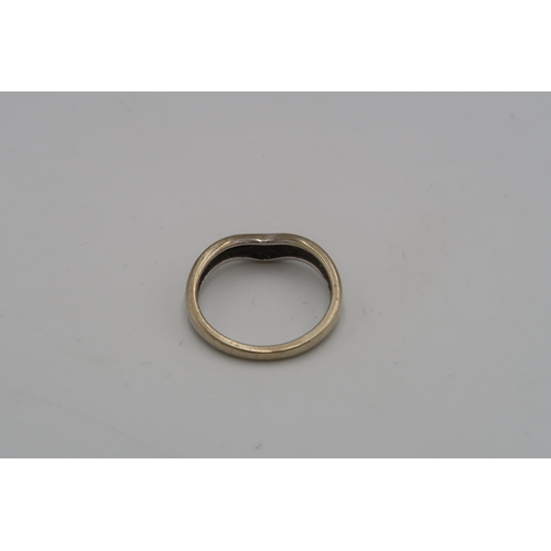 232 - A wishbone ring with diamond set line. Tests 9ct. Size L 1/2. Weight 2.36 grams