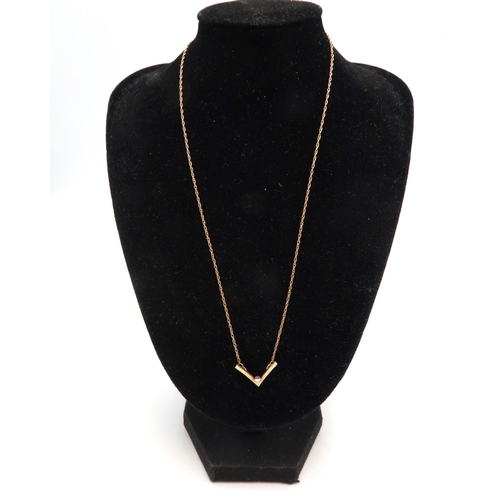 239 - A 9ct gold and diamond set wishbone pendant on 9ct gold chain, 42cm long, total weith 1.8g.