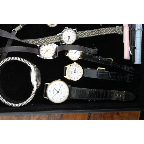 241 - A large group of costume and vintage watches, including Ingersoll, Timex, and Rotary.