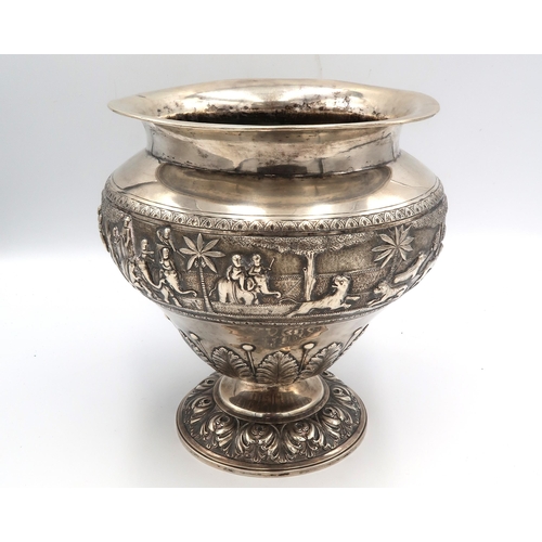 345 - An Indian white metal, likely silver vase of squat baluster form with detailed chased and repousse w... 