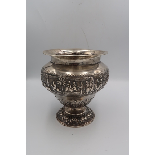 345 - An Indian white metal, likely silver vase of squat baluster form with detailed chased and repousse w... 