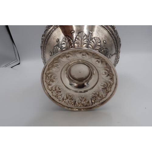 345 - An Indian white metal, likely silver vase of squat baluster form with detailed chased and repousse w... 