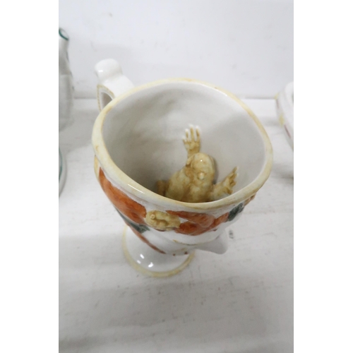 438 - Two Staffordshire cups and a twin handled frog mug A/F