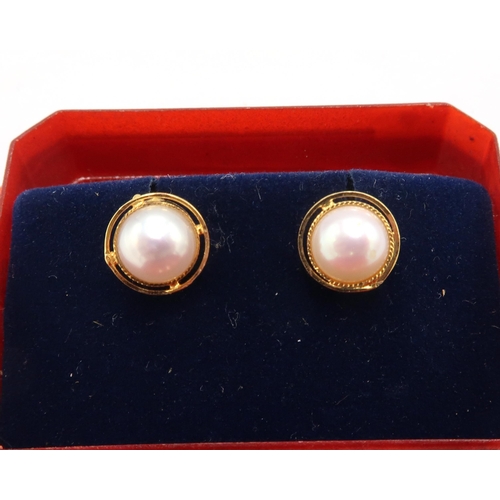 61 - A pair of 18ct gold and pearl earrings, unmarked but testing as 18ct gold, 1.8g including butterfly ... 