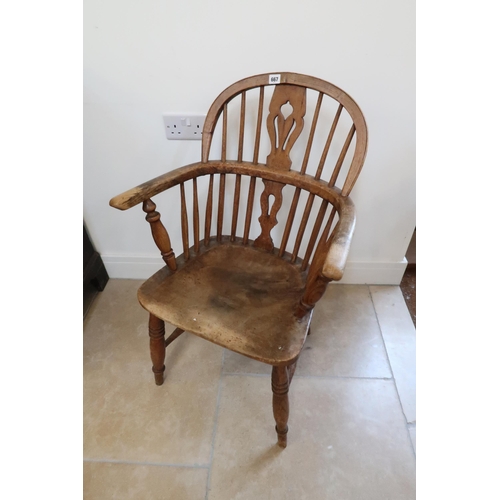 667 - A 19th century Windsor armchair