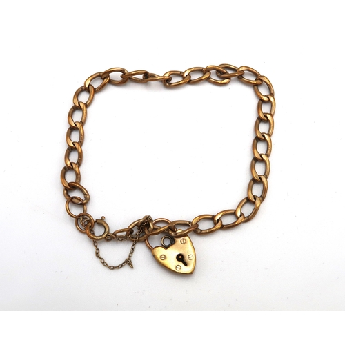 81 - A 9ct gold curb link charm bracelet, with heart shaped padlock clasp, 11.6g.