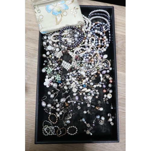 180 - A large group of pearl and silver set earrings, pendants, rings and bracelets, including a number by... 