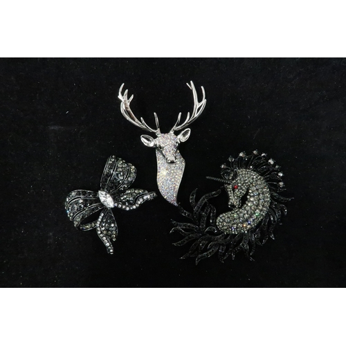 190 - A group of Butler and Wilson Designer jewellery comprising: Stag brooch, Unicorn brooch and classic ... 