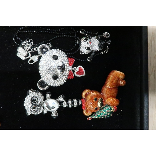 202 - A group of Butler and Wilson Designer animal and bear themed jewellery comprising: panda in a swing ... 