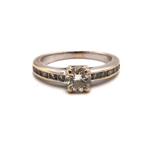 245 - An 18ct white gold (hallmarked) diamond solitaire ring with diamonds to shoulders - principle diamon... 