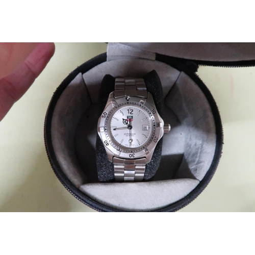 267 - A ladies Tag Professional quartz wristwatch - in working order with its box