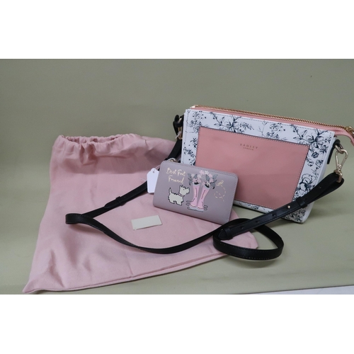 439 - A Radley slim summer handbag, with printed flowers and pale pink leather pocket and shoulder strap, ... 