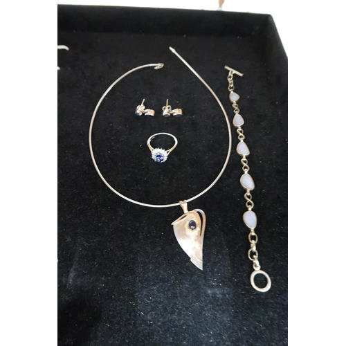 88 - A silver, cubic zirconia and blue stone set dress ring, size T, a silver and opal panelled bracelet,... 