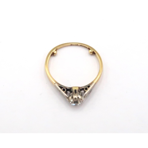 5 - A 18ct & Platinum Diamond solitaire ring with small diamonds set into shoulders. Weight: 2g Size: H ... 