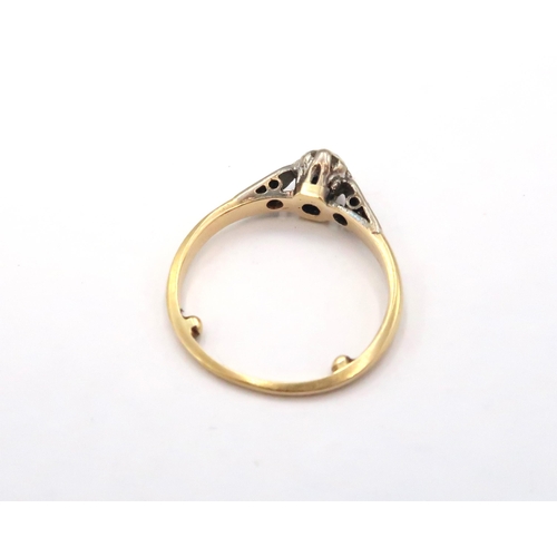 5 - A 18ct & Platinum Diamond solitaire ring with small diamonds set into shoulders. Weight: 2g Size: H ... 