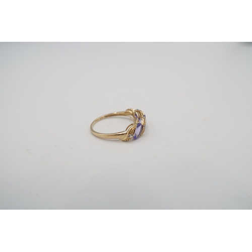 49 - A 9ct Yellow Gold Tanzanite and Diamond Ring, Tanzanites are a Good Colour and Well Matched, Head Si... 