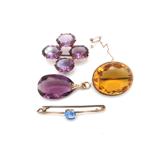 83 - A group of paste jewellery, to include three brooches and a pendant. Mounts test 9ct gold. Weight 50... 