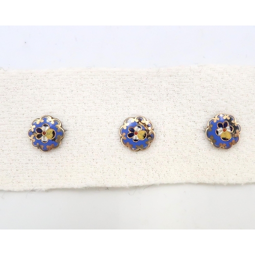 84 - A set of three enamel dress studs. Test gold 9ct. Weight 2.84 grams