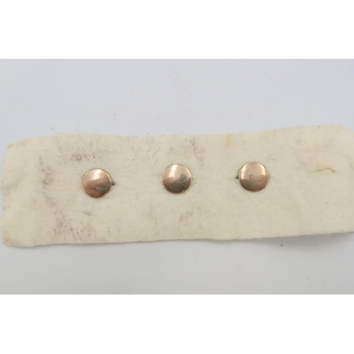 84 - A set of three enamel dress studs. Test gold 9ct. Weight 2.84 grams