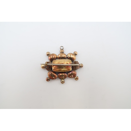 60 - A garnet and seed pearl set mourning pendant brooch of rectangular form, the centre with woven hair ... 
