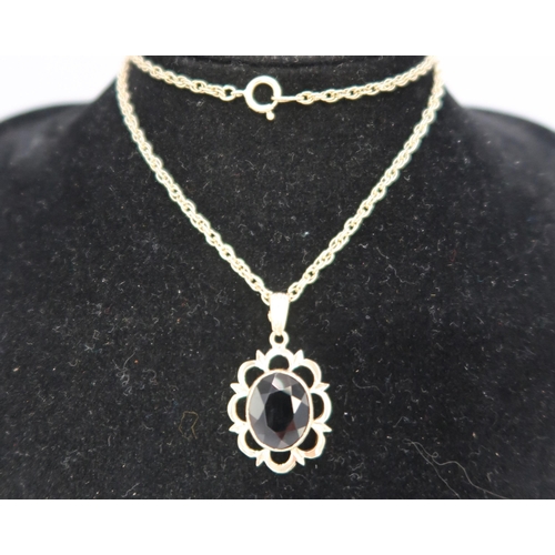 57 - A 9ct Yellow Gold Garnet Pendant on a 9ct Yellow Gold Chain, Pendant approx. 21mm x 16mm not includi... 